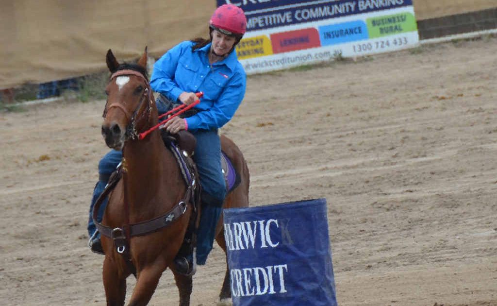 Kristy Banks on her horse Bob in the ladies barrel racing. Kristy Banks on her horse Bob in the ladies barrel racing.